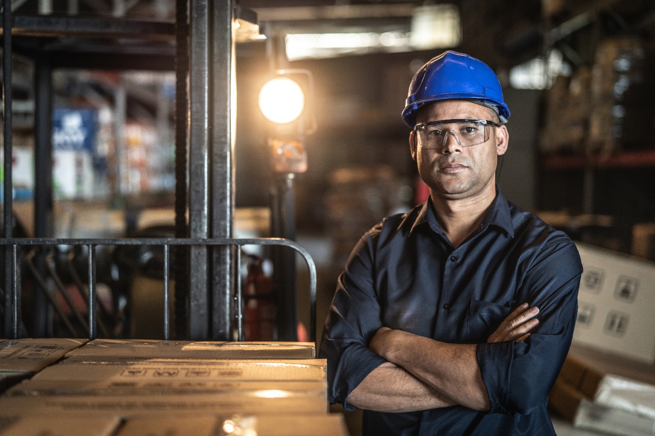 Man with Folded Arms with Blue Hard Hat