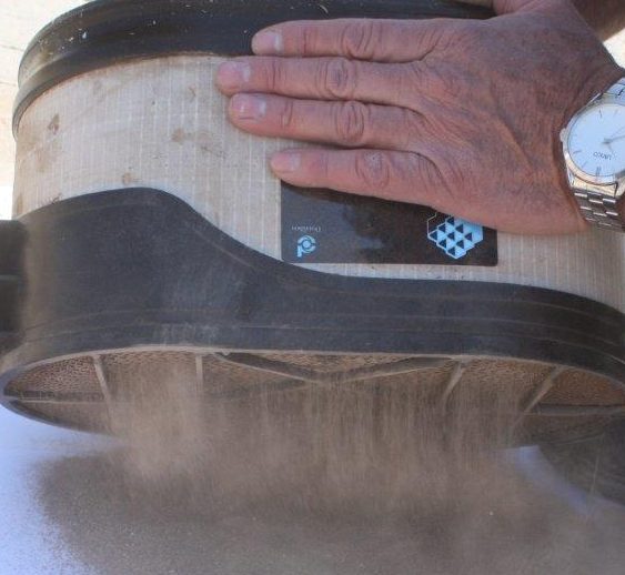 Dust from the race pours out of a Powercore filter.