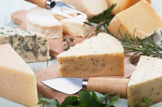 Assorted cheese on wooden table, rich and healthy snack or breakfastStock Photography: iStock-475563104.jpg