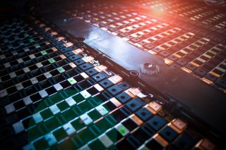 Electric vehicle battery module with lens flare effect. Concept of EV batteries maintenance.