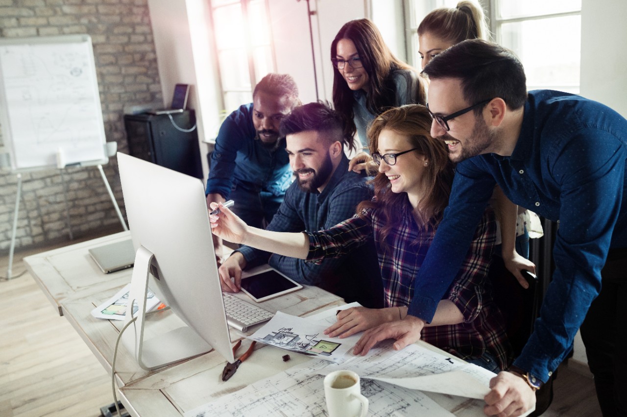 Team Meeting Around Computer